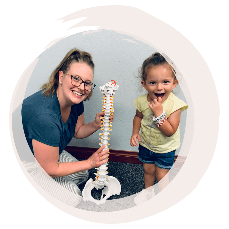 Chiropractor Rothschild WI Giana Backes with Pediatric Patient